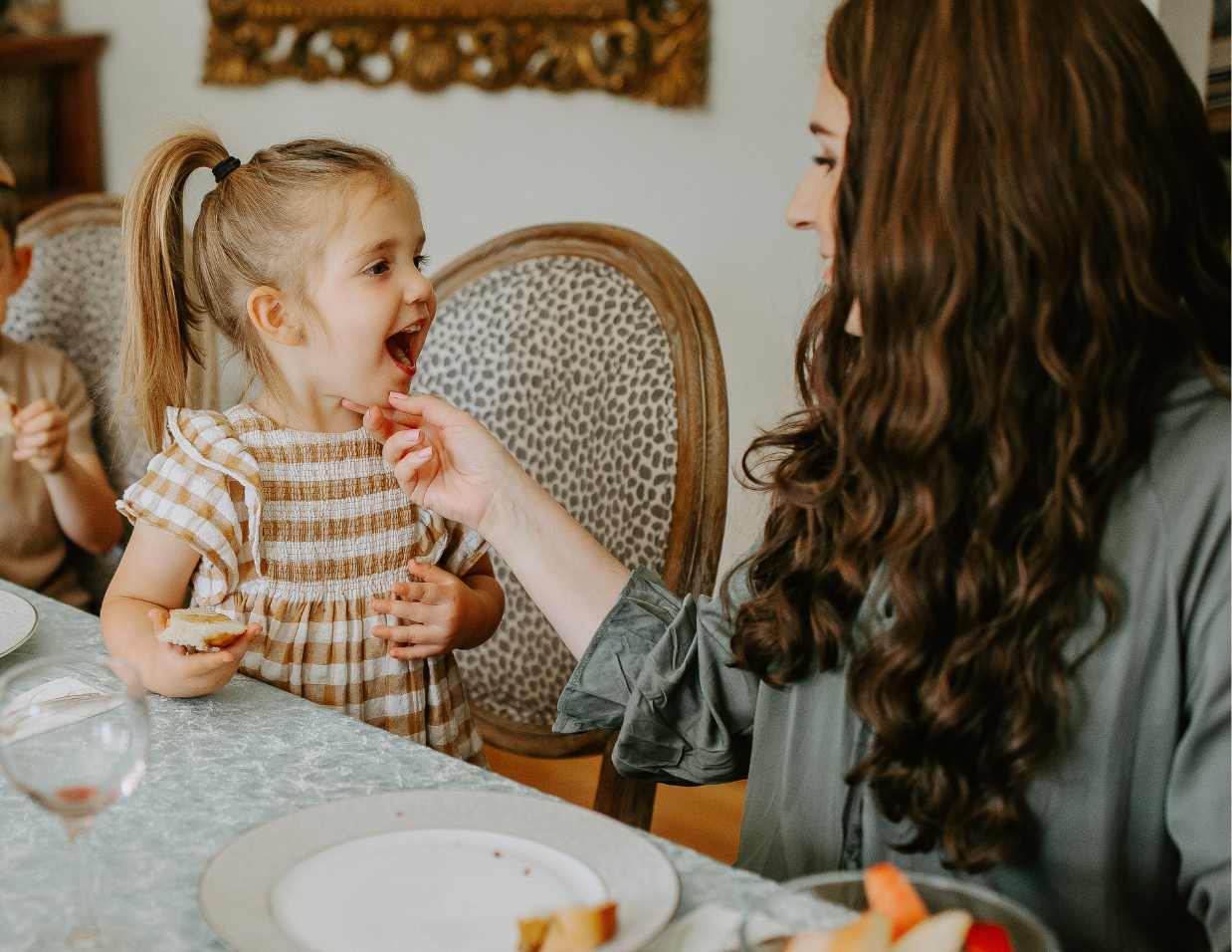 mom and daughter at a table