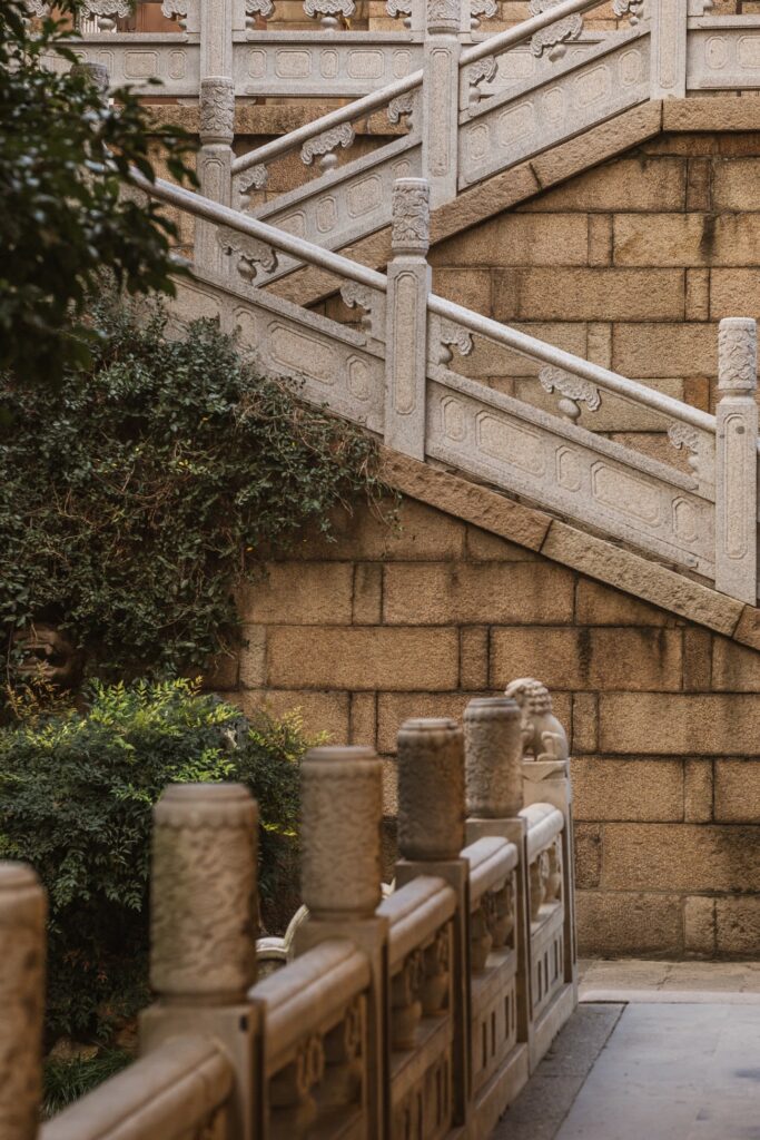 stairs and bridge. pretty shades of brown with some green bushes.