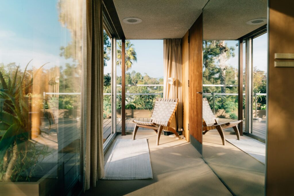 pretty chair in a pretty room looking out a window to pretty land